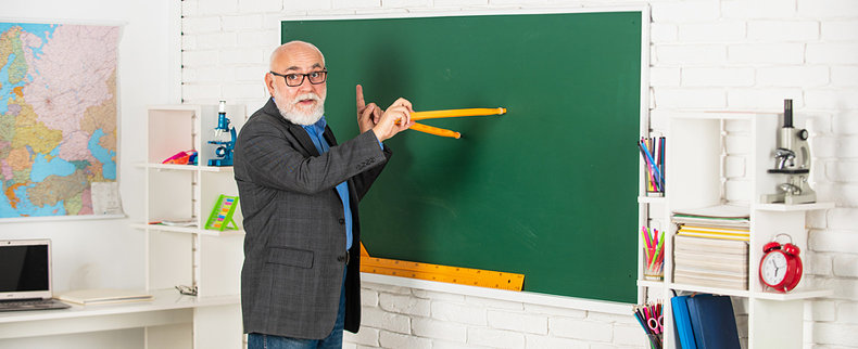 Teacher at Blackboard